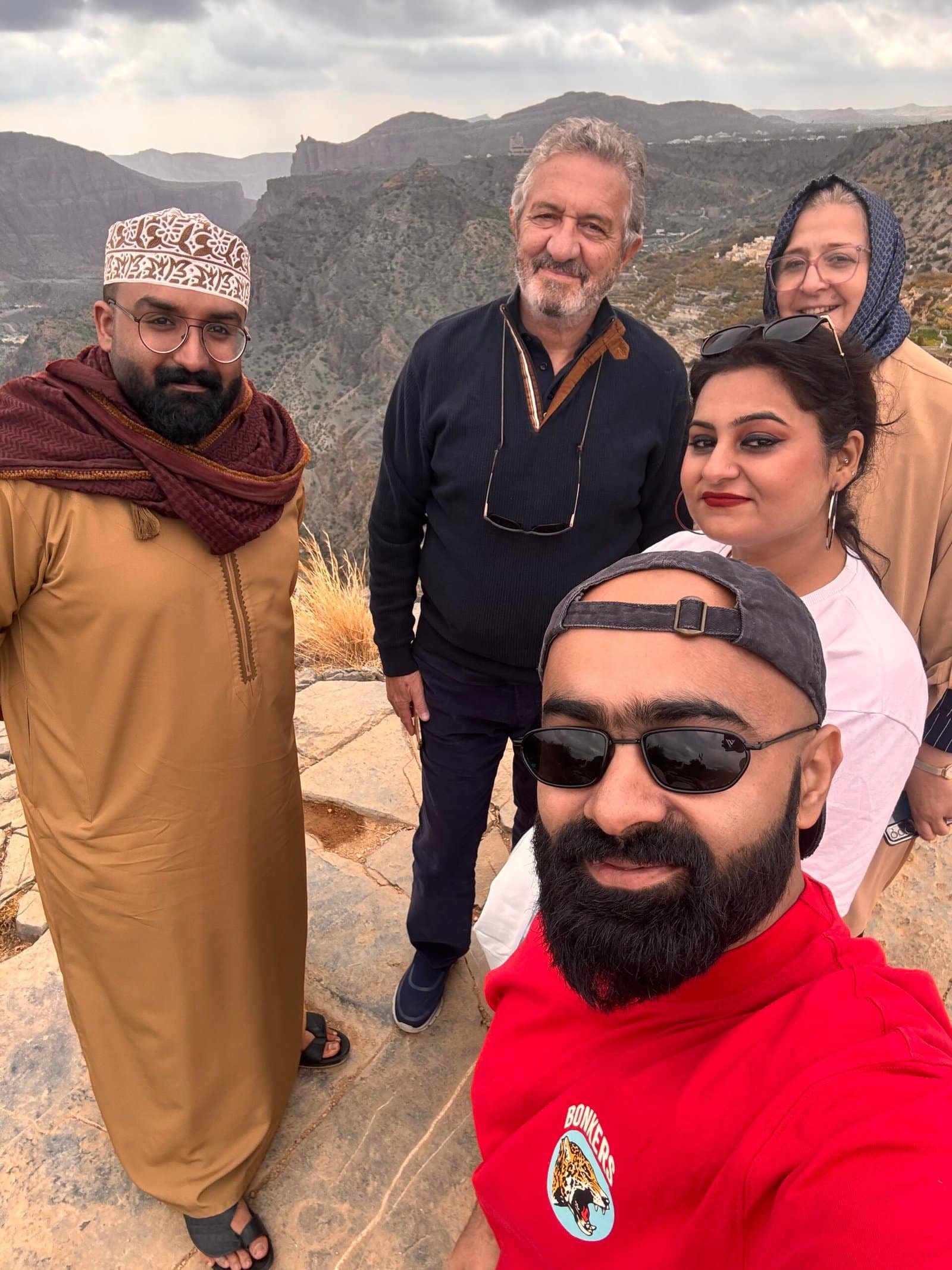group tour travelers dressed respectfully in oman